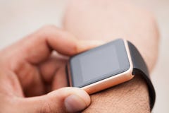 Hands of black man using modern smart wrist watch stock photos Hands of black man using modern smart wrist watch stock photos