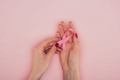 Hands with Breast cancer awareness ribbon royalty free stock photos Hands with Breast cancer awareness ribbon royalty free stock photos