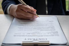 Hands of business man signing the contract document royalty free stock images Hands of business man signing the contract document royalty free stock images