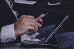 Hands of businessmen are working with laptops on cars.while traveling stock photos Hands of businessmen are working with laptops on cars.while traveling stock photos