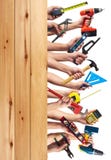 Hands with DIY tools.