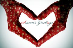 Hands Forming A Heart And The Sentence Seasons Greetings Royalty Free Stock Photo Hands Forming A Heart And The Sentence Seasons Greetings Royalty Free Stock Photo