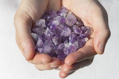Hands holding beautiful amethyst points royalty free stock photography Hands holding beautiful amethyst points royalty free stock photography