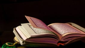 The Holy book of muslims/ Quran hands hold the koran stock image The Holy book of muslims/ Quran hands hold the koran stock image