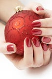 Hands Holding Precious Red Christmas Globe Stock Photography Hands Holding Precious Red Christmas Globe Stock Photography