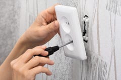 Hands Installing A Wall Power Socket Hands Installing A Wall Power Socket