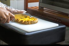 Hands knife cutting of sliced bread bakery stock photography Hands knife cutting of sliced bread bakery stock photography