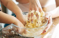 Hands of mother and child making dough royalty free stock images Hands of mother and child making dough royalty free stock images