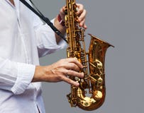 Hands Of A Musician With The Saxophone Stock Photos