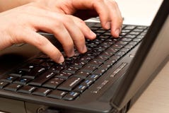 Hands On Laptop Keyboard Royalty Free Stock Photography