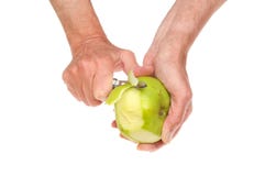 Hands Peeling Apple Royalty Free Stock Photos