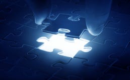 Hands placing last piece of a Puzzle royalty free stock photography Hands placing last piece of a Puzzle royalty free stock photography