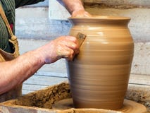 Hands of a Potter make a big pot royalty free stock photo Hands of a Potter make a big pot royalty free stock photo