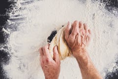 Hands top view knead dough on black background stock photos Hands top view knead dough on black background stock photos