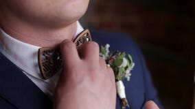 Hands of wedding groom in a white shirt dress cufflinks. Elegant groom. Wedding groom suit jacket stock footage Hands of wedding groom in a white shirt dress cufflinks. Elegant groom. Wedding groom suit jacket stock footage