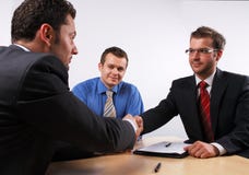Handshake over signed cotract stock images Handshake over signed cotract stock images