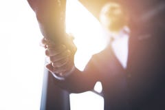 Handshaking business person in the office with network effect. concept of teamwork and partnership royalty free stock images Handshaking business person in the office with network effect. concept of teamwork and partnership royalty free stock images