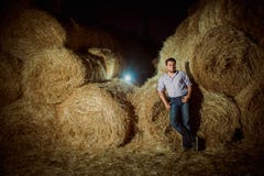 Handsome caucasian young man in the hay barn Stock Photography Handsome caucasian young man in the hay barn Stock Photography