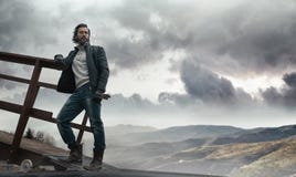 Handsome dark-haired man restin in the country area royalty free stock photo Handsome dark-haired man restin in the country area royalty free stock photo
