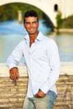 Handsome man Italian outdoors in Rome Italy. Tiber river and bridge royalty free stock photos Handsome man Italian outdoors in Rome Italy. Tiber river and bridge royalty free stock photos
