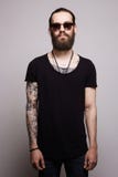 Handsome man with tattoo and sunglasses stock photo Handsome man with tattoo and sunglasses stock photo