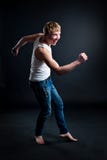 Handsome man wearing white blank t-shirt with dark grunge wall. On background Royalty Free Stock Photo Handsome man wearing white blank t-shirt with dark grunge wall. On background Royalty Free Stock Photo