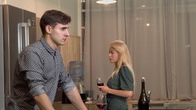 Handsome man drinking wine after having a fight with his girlfriend at home stock photography Handsome man drinking wine after having a fight with his girlfriend at home stock photography