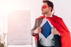 handsome super businessman in mask and cape showing blue shirt royalty free stock images handsome super businessman in mask and cape showing blue shirt royalty free stock images
