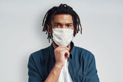 Handsome young African man wearing medical face mask