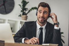 handsome young technical support worker making call royalty free stock image handsome young technical support worker making call royalty free stock image