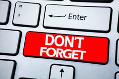 Handwriting Announcement text showing Do Not Forget. Business concept for Don t memory Remider written on red key on the keybord b Royalty Free Stock Photos Handwriting Announcement text showing Do Not Forget. Business concept for Don t memory Remider written on red key on the keybord b Royalty Free Stock Photos