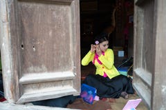 Hanoi, Vietnam - Jun 22, 2017: Actress making up before a traditional operetta in communal house at So village, Quoc Oai district. stock image Hanoi, Vietnam - Jun 22, 2017: Actress making up before a traditional operetta in communal house at So village, Quoc Oai district. stock image
