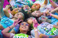 Hanoi, Vietnam - Sep 23, 2015: Group of teenagers taking photo at public color run event in Hanoi capital city. Hundreds of people Stock Photos Hanoi, Vietnam - Sep 23, 2015: Group of teenagers taking photo at public color run event in Hanoi capital city. Hundreds of people Stock Photos