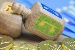 Hanukkah Dreidels, Napkins and Chocolate Gelt Coins royalty free stock photography Hanukkah Dreidels, Napkins and Chocolate Gelt Coins royalty free stock photography