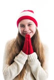 Happiness winter holidays christmas. Teenager concept - smiling young woman in red hat, scarf and over white background. royalty free stock images Happiness winter holidays christmas. Teenager concept - smiling young woman in red hat, scarf and over white background. royalty free stock images