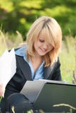 Happiness woman working on nature with documents royalty free stock images Happiness woman working on nature with documents royalty free stock images
