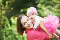 Happpy Mother Holding Her Baby Girl Stock Image
