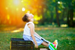 Happy adorable little kid girl reading book and holding different colorful books on first day to school or nursery stock images Happy adorable little kid girl reading book and holding different colorful books on first day to school or nursery stock images