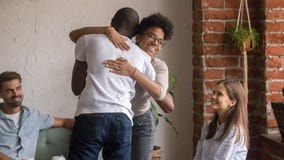 Happy african man and woman hugging greeting at friends meeting royalty free stock images Happy african man and woman hugging greeting at friends meeting royalty free stock images