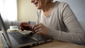 Happy aged lady typing message on laptop, communicating on dating website stock images Happy aged lady typing message on laptop, communicating on dating website stock images