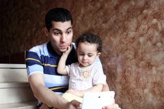 Happy arab egyptian father with daughter taking selfie royalty free stock photo Happy arab egyptian father with daughter taking selfie royalty free stock photo