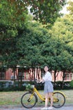 Happy Asian Chinese Pretty Girl Riding A Bike Wear Student Suit In School Royalty Free Stock Photos Happy Asian Chinese Pretty Girl Riding A Bike Wear Student Suit In School Royalty Free Stock Photos