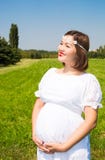 Happy asian pregnant woman with big belly rest on nature royalty free stock photo Happy asian pregnant woman with big belly rest on nature royalty free stock photo