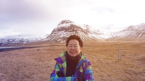 Happy Asian senior woman fun trip in Europe photo with Iceland glacier royalty free stock photos Happy Asian senior woman fun trip in Europe photo with Iceland glacier royalty free stock photos