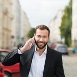 Happy attractive businessman on his mobile phone royalty free stock photo Happy attractive businessman on his mobile phone royalty free stock photo