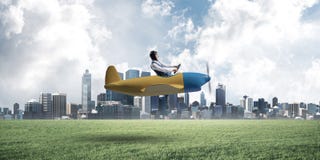 Happy aviator driving small propeller plane royalty free stock images Happy aviator driving small propeller plane royalty free stock images