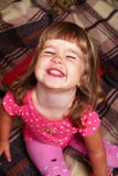 Happy baby with brown plaid Stock Images Happy baby with brown plaid Stock Images