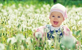 Happy Baby Girl On Meadow With White Flowers On The Nature Stock Image Happy Baby Girl On Meadow With White Flowers On The Nature Stock Image