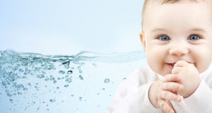 Happy baby over blue background with water splash Royalty Free Stock Image Happy baby over blue background with water splash Royalty Free Stock Image
