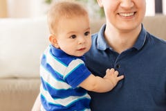 Happy baby son with father at home stock photo Happy baby son with father at home stock photo